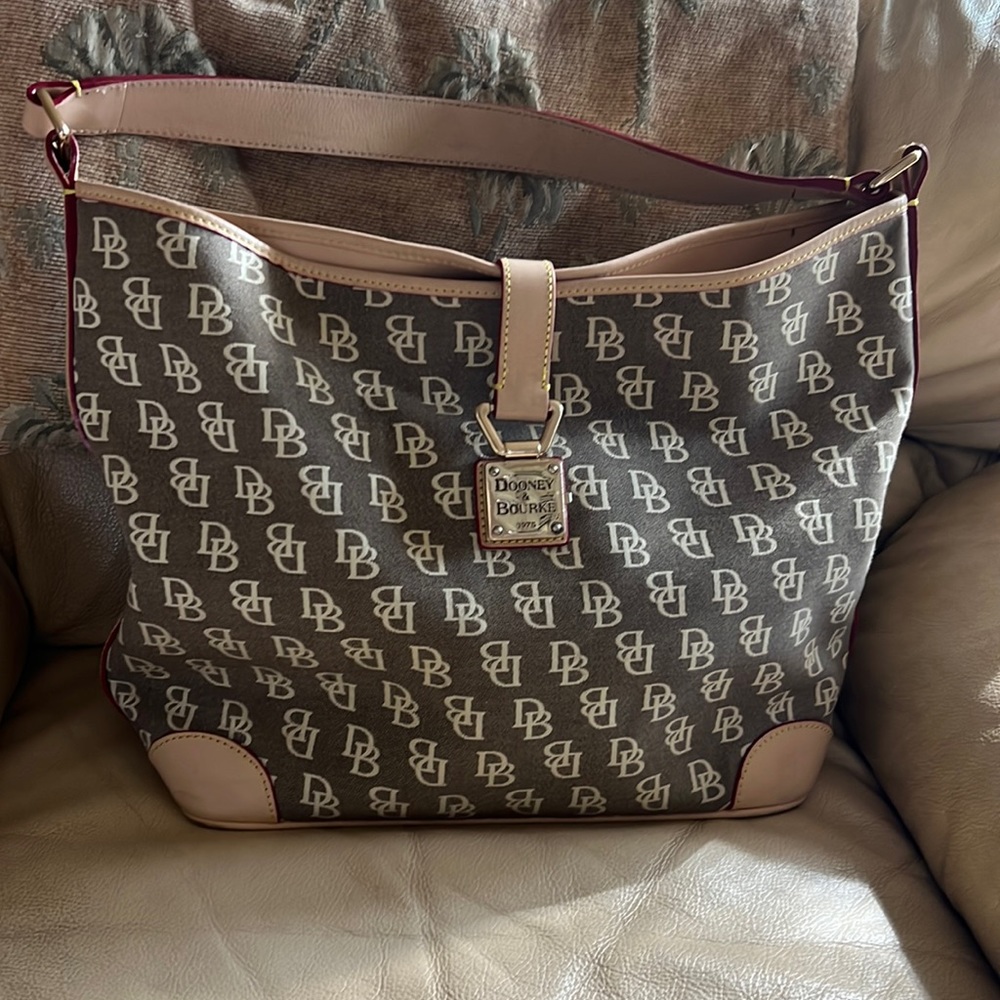 DOONEY & BOURKE Vintage monogram hobo bag. Leather handle & trim. Metal latch.